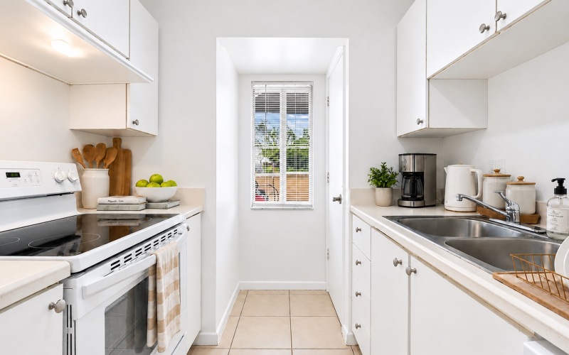 a kitchen with white cabinets